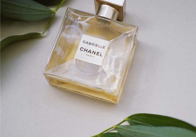 Chanel Gabrielle Essense Eau De Parfum parfume between leaves